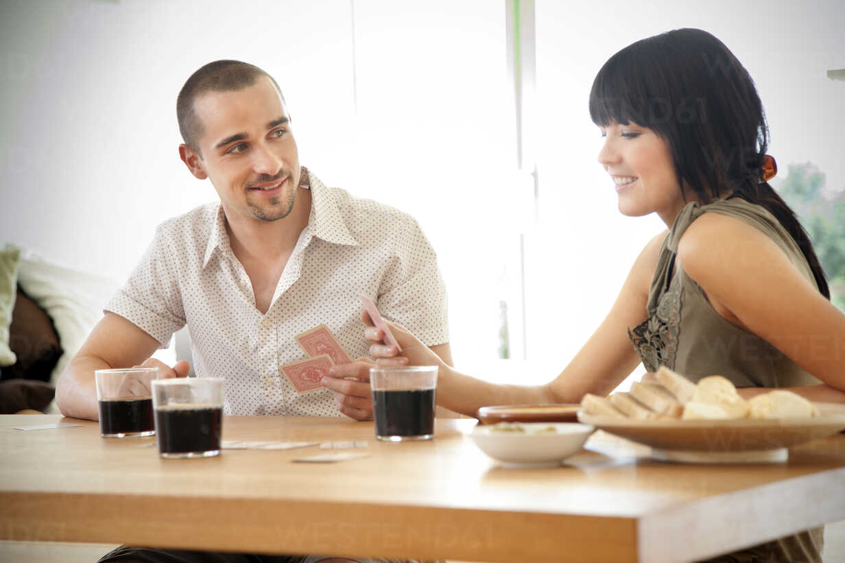 Friends playing cards stock photo