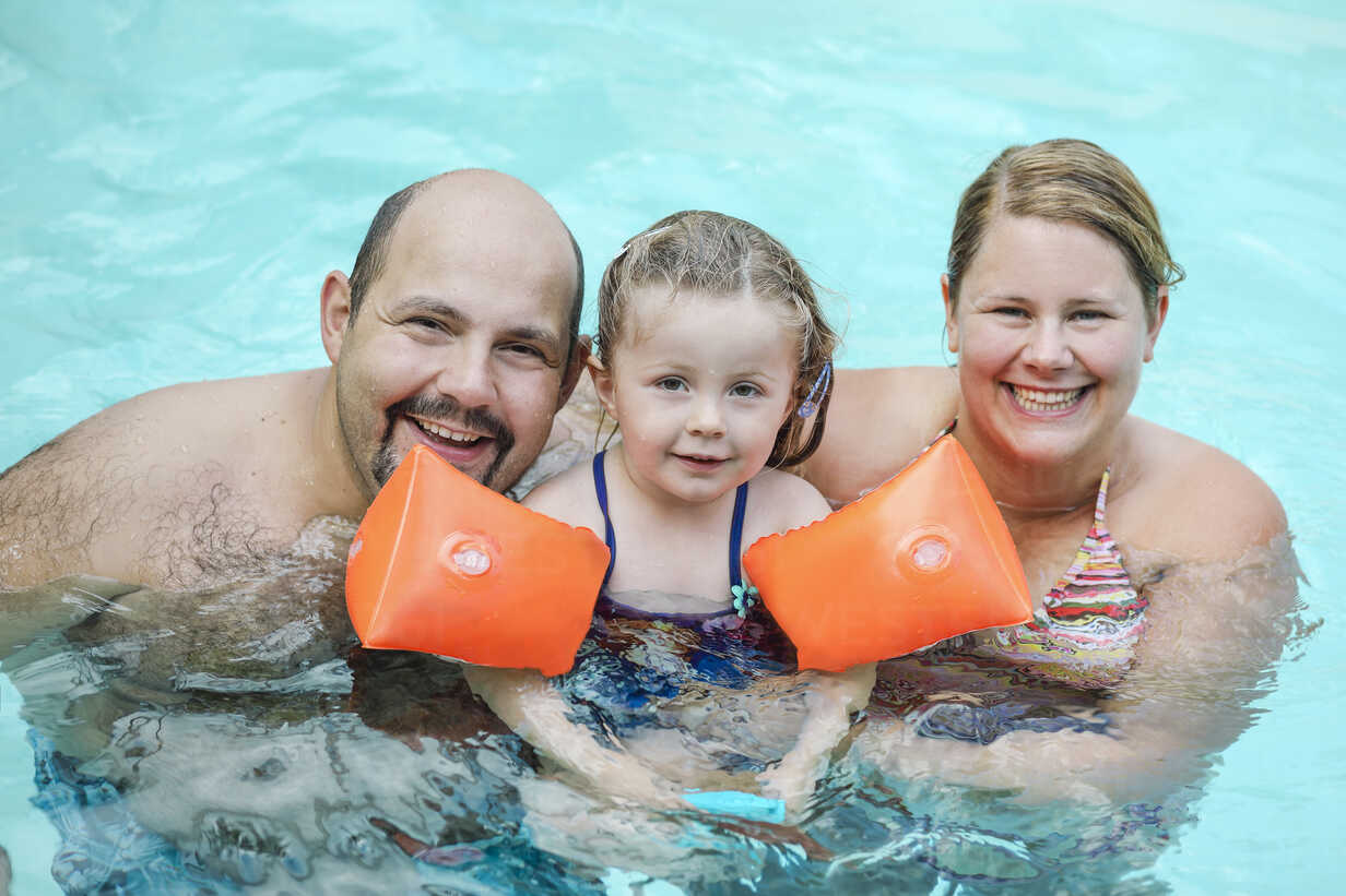 Family portrait in swimming pool stock photo